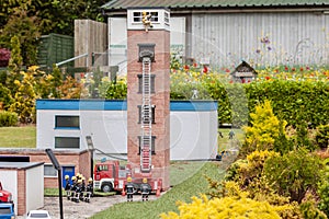 Closeup of firemen at a model village