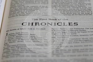 Closeup of the first Book of Chronicles from Bible or Torah, with focus on the Title of Christian and Jewish religious text.