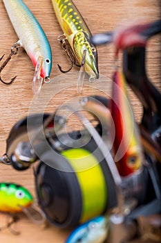 Closeup fishing baits wobblers with reel