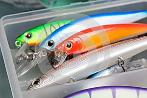 Closeup of a fishing box with colorful lures.