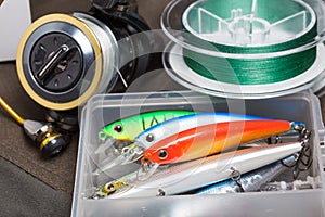 Closeup of a fishing box with colorful lures.