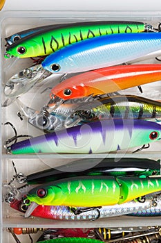 Closeup of a fishing box with colorful lures.