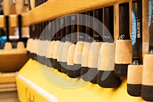 Closeup of fishing rods lined up for sale in a popular sporting goods retailer