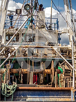 Closeup of fish cutter docked at the port photo