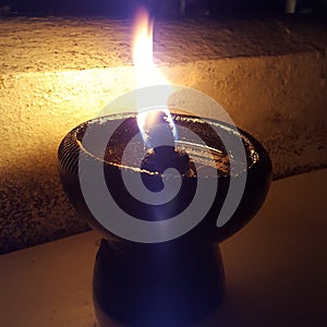 Closeup flame from oil lamp at night
