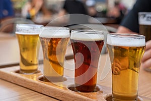 Closeup of a flight of cold beer on a restaurant table