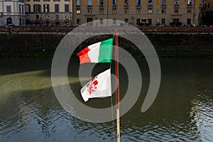 Closeup of a Florence city Flag and the Italian flag, red lily on a white background. Tuscany, Italy, Europe