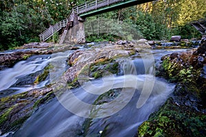 Closeup of the flow of a rocky river with a silky water effect