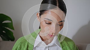 Closeup focused student girl learning attentively at home place. Woman studying