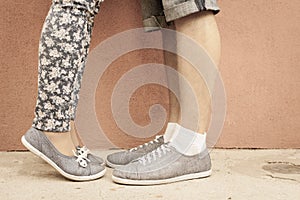 Closeup foot of kissing couple outdoor at street