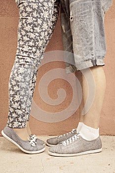 Closeup foot of kissing couple outdoor at street