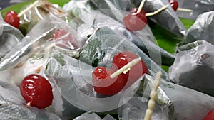 Closeup footage of sweet masala Paan, a preparation combining betel leaf with areca nut, tobacco widely consumed throughout,