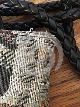 Closeup of Frayed Edges of Weaved Bag and Leather Strap