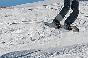 Closeup of freestyle snowboarder jump