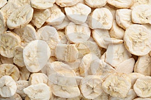 Closeup of freeze dried bananas as background, top view