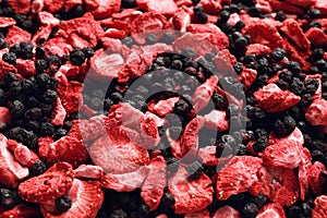 Closeup of freeze dried blueberries and strawberries as background