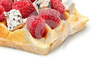 Closeup of french waffles with raspberries and dorblu cheese