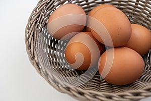Closeup of fresh brown eggs in Easter basket