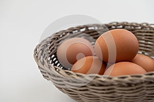 Closeup of fresh brown eggs in Easter basket