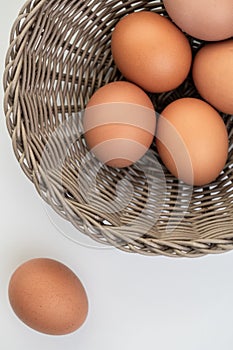 Closeup of fresh brown eggs in Easter basket