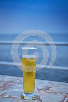Closeup of fresh glass of blond beer