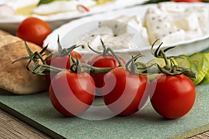 Closeup of fresh tomatoes against cheese