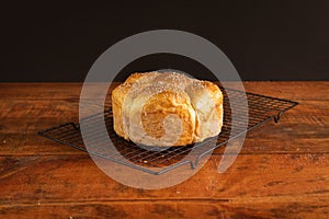 Closeup of a freshly baked pastry on a metal tray on the table