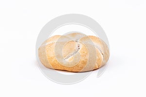 Closeup of a freshly baked white bread bun isolated on a white background