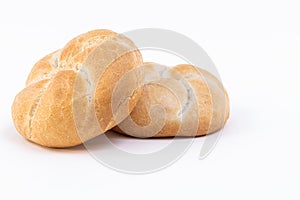 Closeup of freshly baked white bread buns isolated on a white background