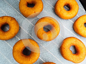 Closeup of freshly made dark brown doughnuts