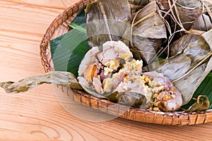 Closeup on Freshly steamed Chinese rice dumpling on traditional rattan tray