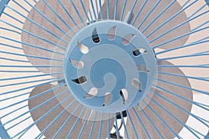 The closeup front view of a universal serial bus powered blue portable table fan