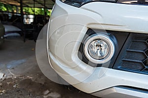 Closeup of front view of a white car modern technology head light with xenon lamp