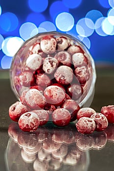 Closeup of the frozen cherry in the glass reflecting on the surface
