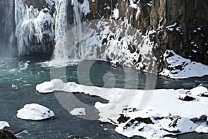 Closeup of frozen waterfall Godafoss, Iceland