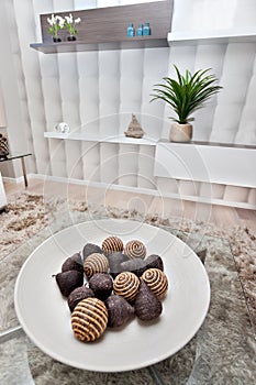 Closeup of a fruit shaped small fancy items made in bamboo, reed and thread on a dish