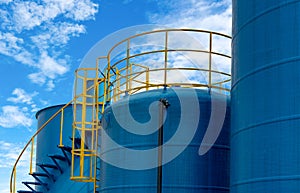 Closeup fuel storage tank in petroleum refinery. Blue big tank of oil storage. Fuel silo. Liquid petroleum tank. Petroleum oil