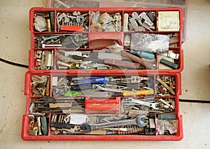 Closeup of a full carpenter toolbox.