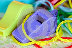 Closeup of Fun Colorful Plastic Whistles