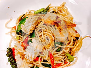 Closeup fusion seafood stir fried spicy spaghetti