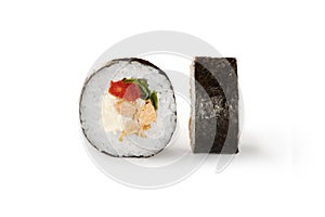 Closeup of futomaki roll with baked salmon on white
