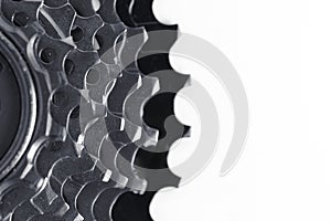 Closeup of a gear wheel on a white background with copy space.