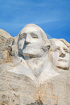 Closeup of George Washington and Thomas Jefferson. Presidential sculpture at Mount Rushmore National Monument, South Dakota, USA.