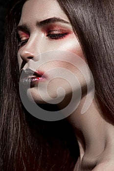 Closeup girl with expresive black and red makeup