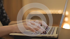 Closeup of girl's hands laptop