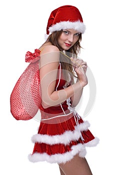 Closeup of girl in santa dress and gifts bag