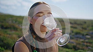 Closeup girl tasting milk with dairy mustache. Relaxed model resting countryside