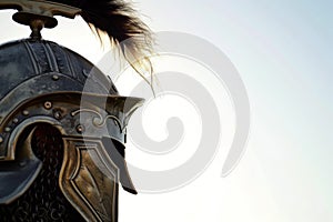 closeup of a gladiators helmet with plume, against a clear sky