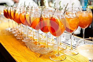 Closeup glass of orange alcoholic cocktails decorated with citrus slices