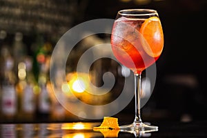 Closeup glass of spritz aperol cocktail decorated with orange